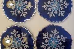 Set of 4 Snowflake Resin Coasters Blue Background